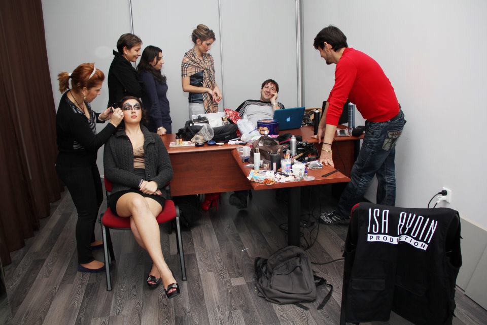Behind the scenes with models during makeup photoshoot