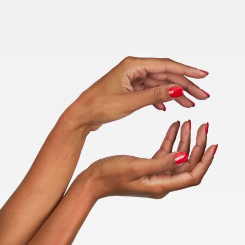 Professional commercial photoshoot with a female hand model on a white background