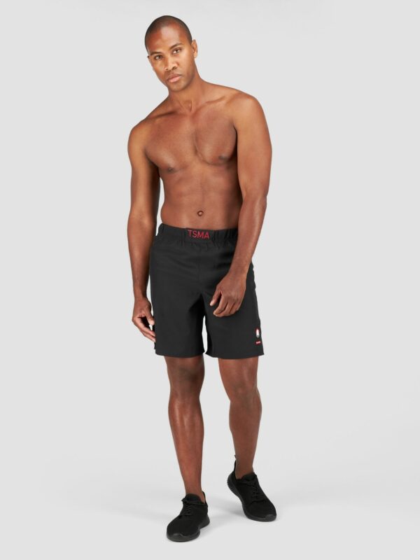 Product shot of a male model wearing sport shorts in black