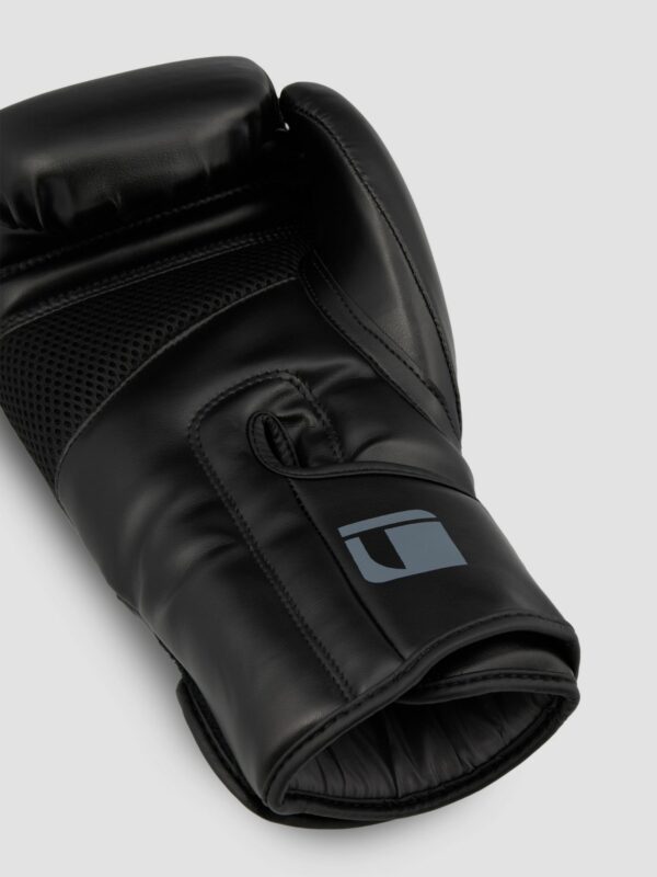 Product photography of a black leather glove with white background