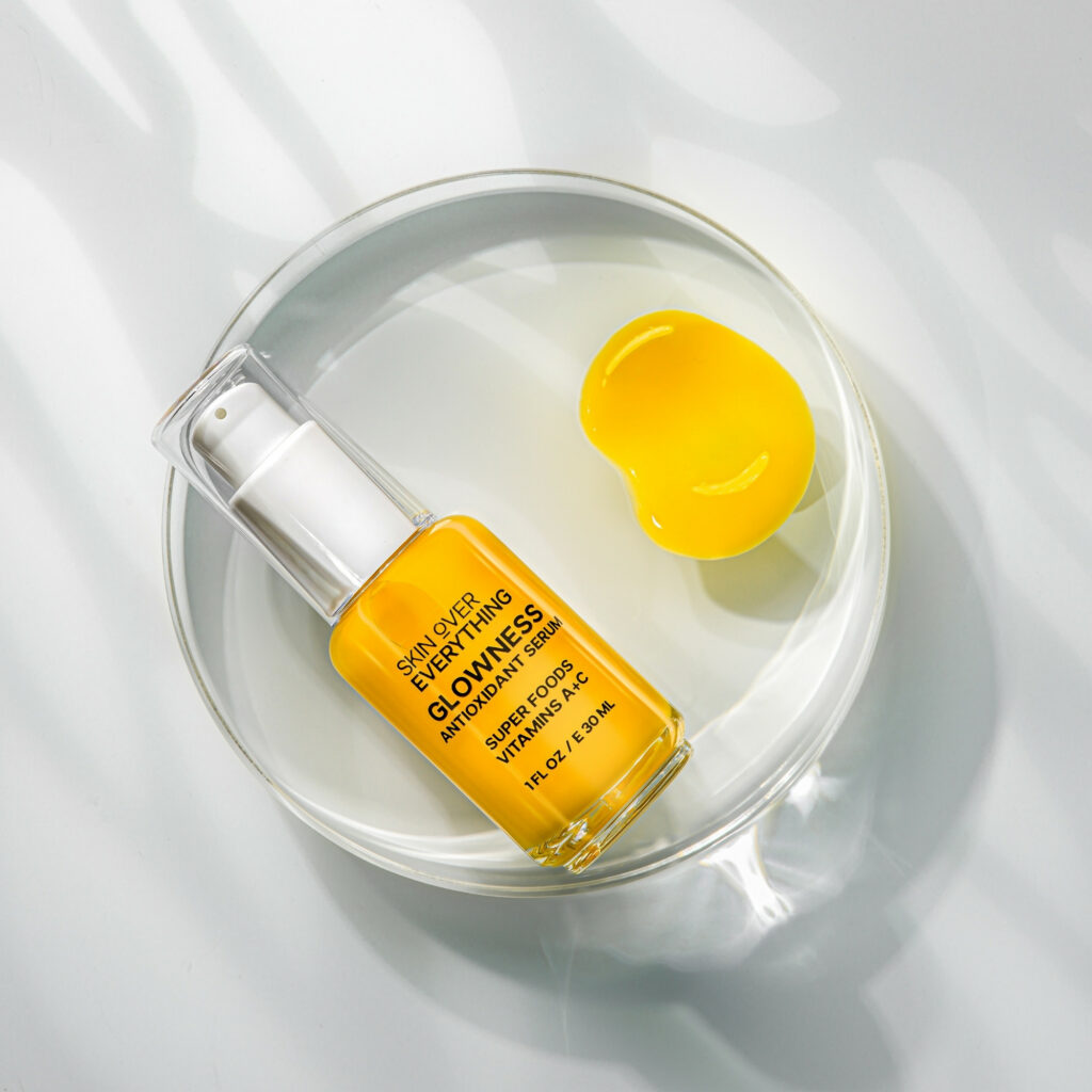serum with yellow texture swatch placed on round acrylic block and shot using gobo lighting by Isa Aydin NJ NY LA