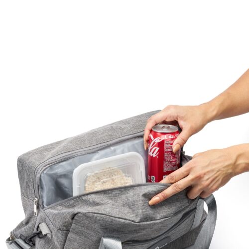Action shot of a female hand model placing Coca Cola and other food items in a travel bag by Isa Aydin NJ NY LA