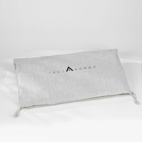 Lucid grey colored foldable travel bag shot on a white textured background by Isa Aydin nj ny la