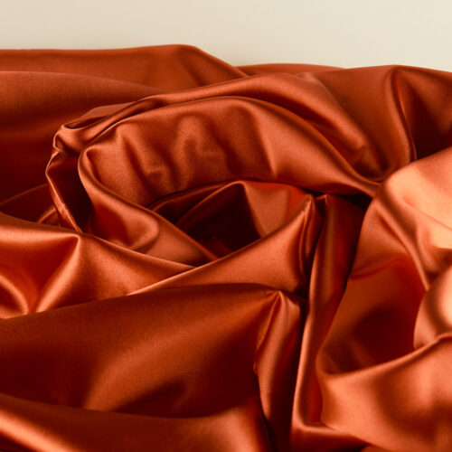 Orange color creative material props on a lay-flat angle by Isa Aydin nj ny la