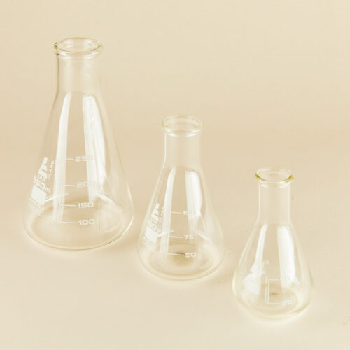 Lab glassware props set on a beige background by Isa Aydin nj ny la